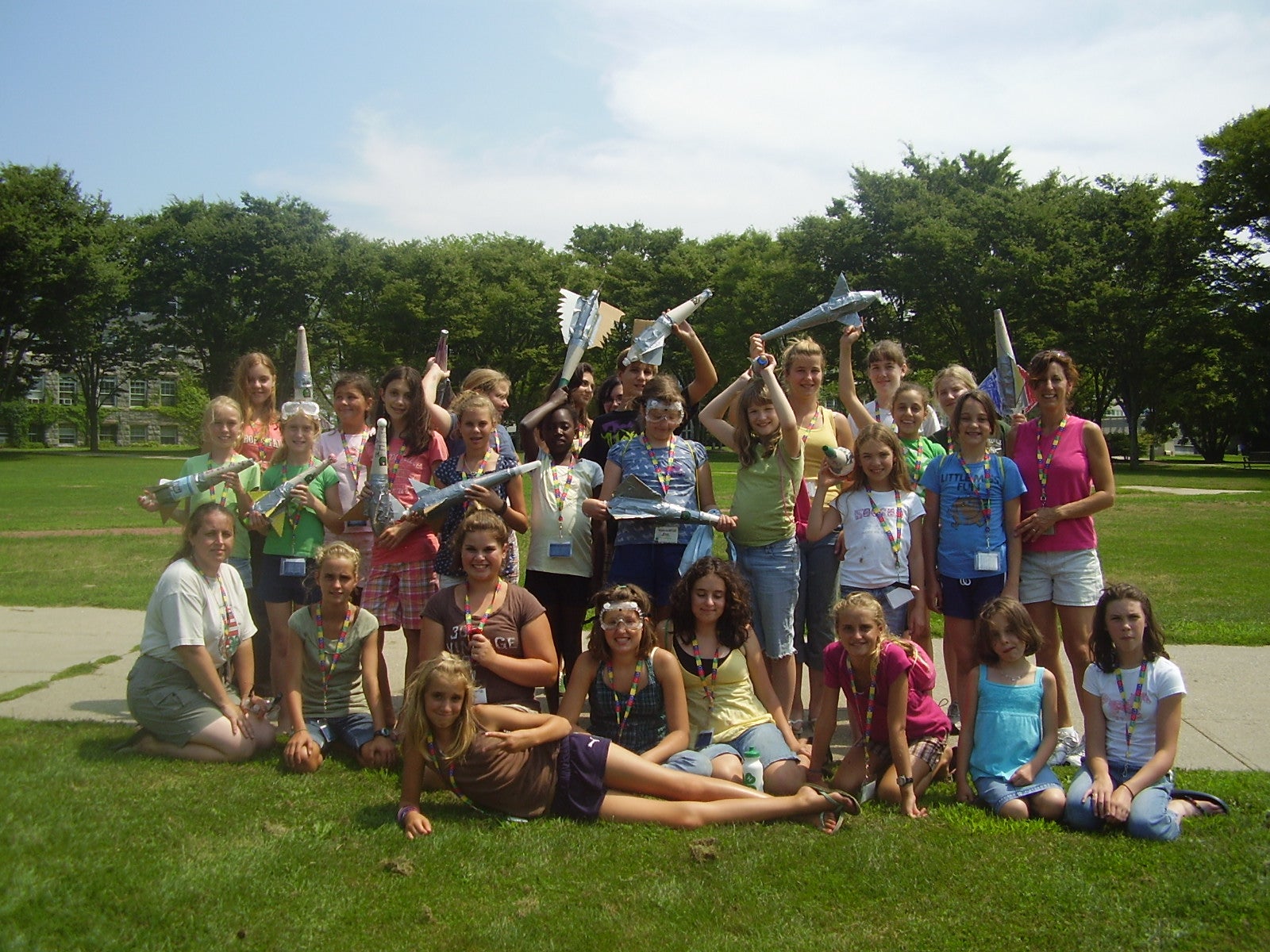 Group of Gilrs holding toy rockets