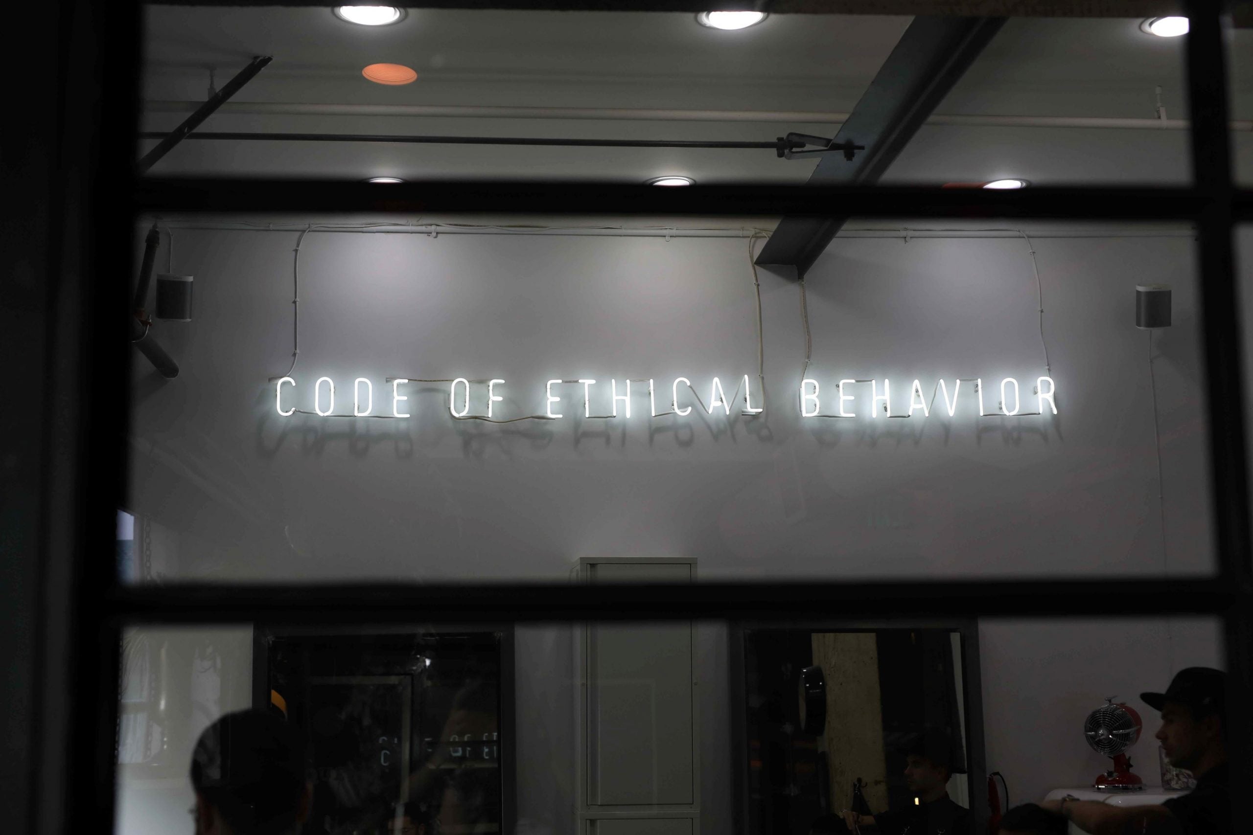 sign that says code of ethical behavior