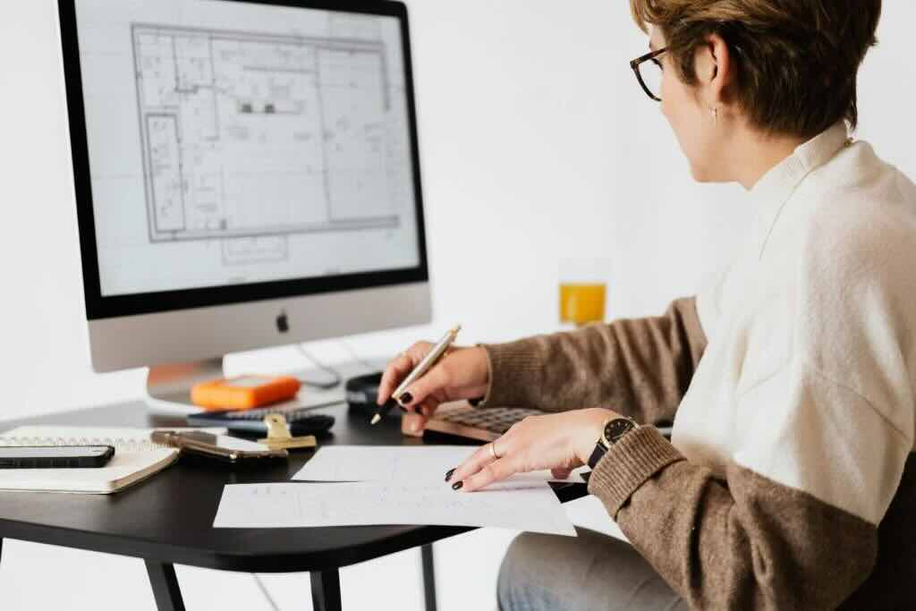 Woman using laptop at a desk