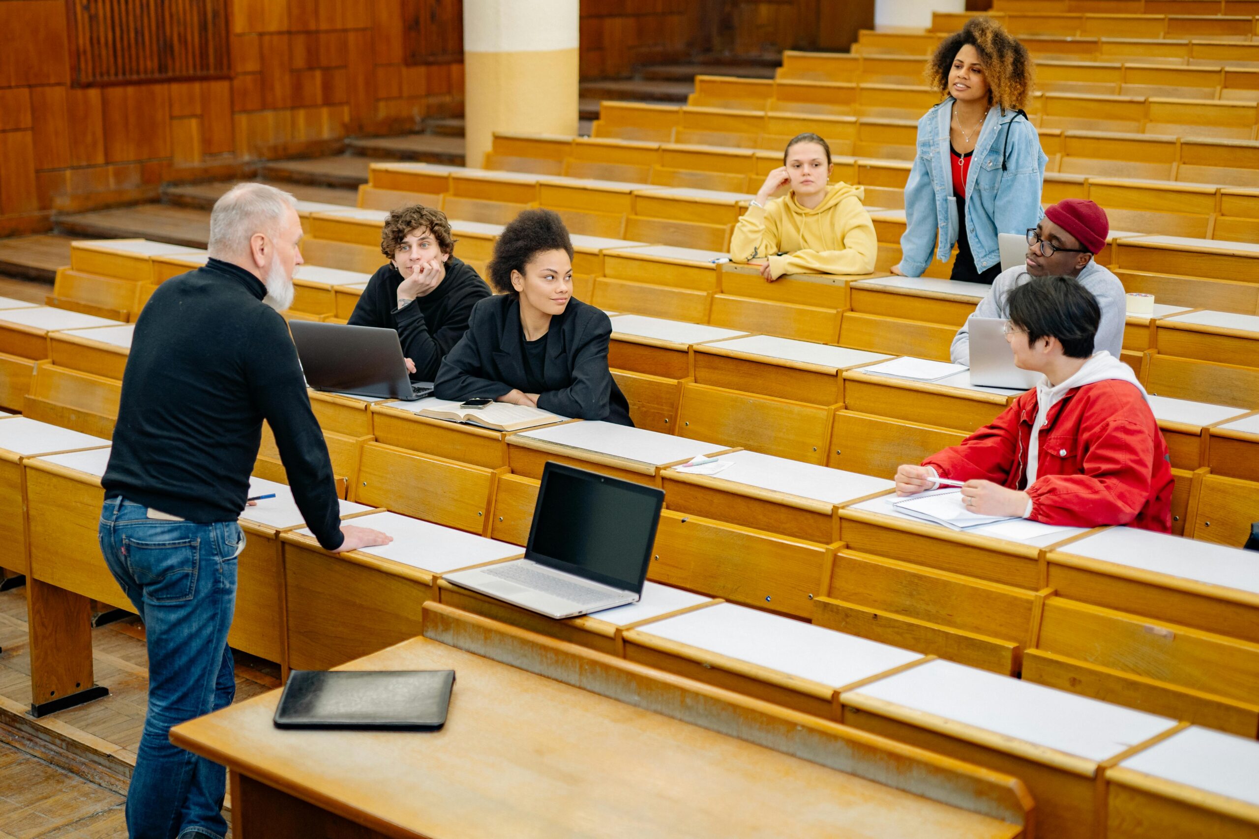 College professor leading a class discussion.