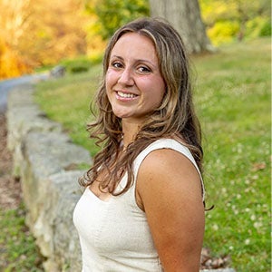 URI student smiling standing outside