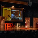 TEDxURI at Edwards Hall, presenter on the stage