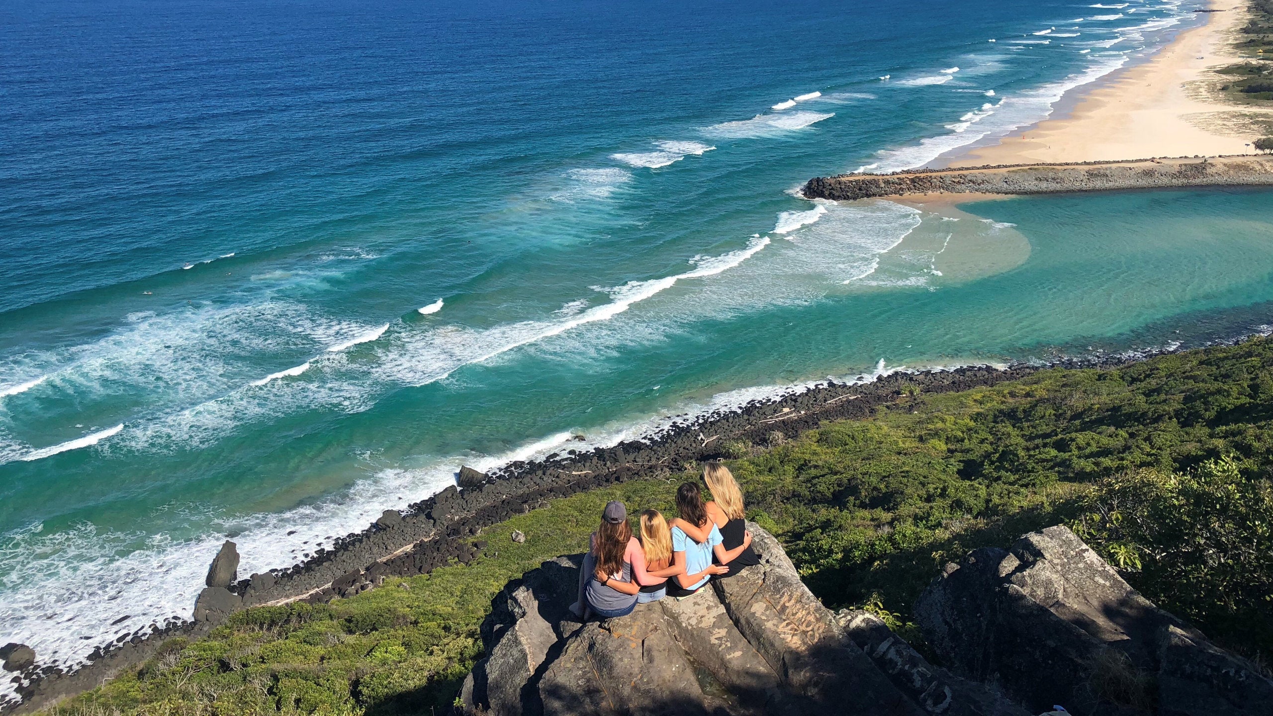 Four students look out at the ocean in Australia