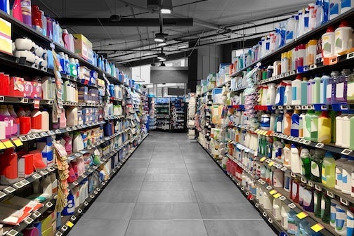 consumer aisle with products on multiple shelves.
