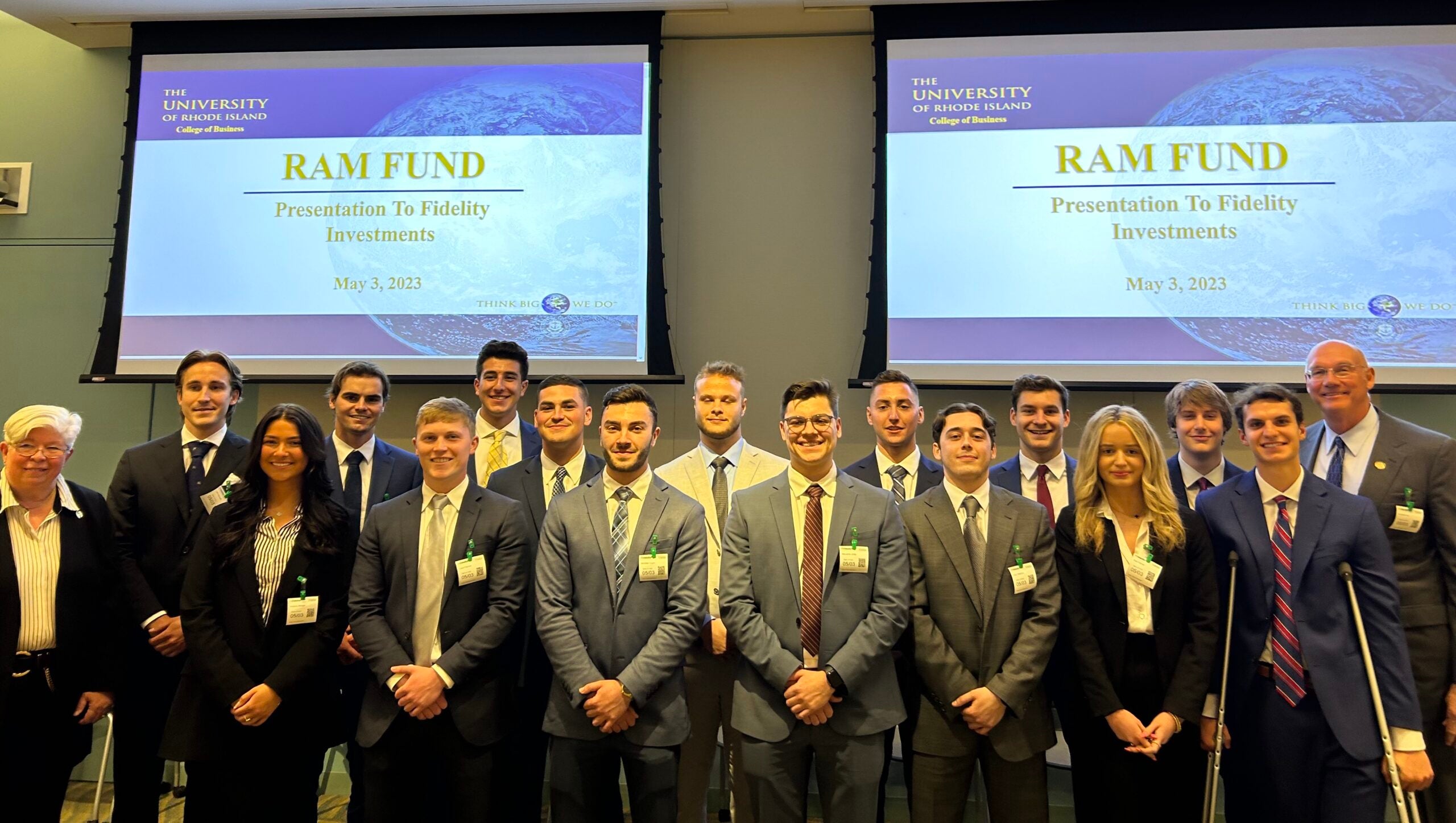 Students standing in fromnt of screens that say Ram Fund