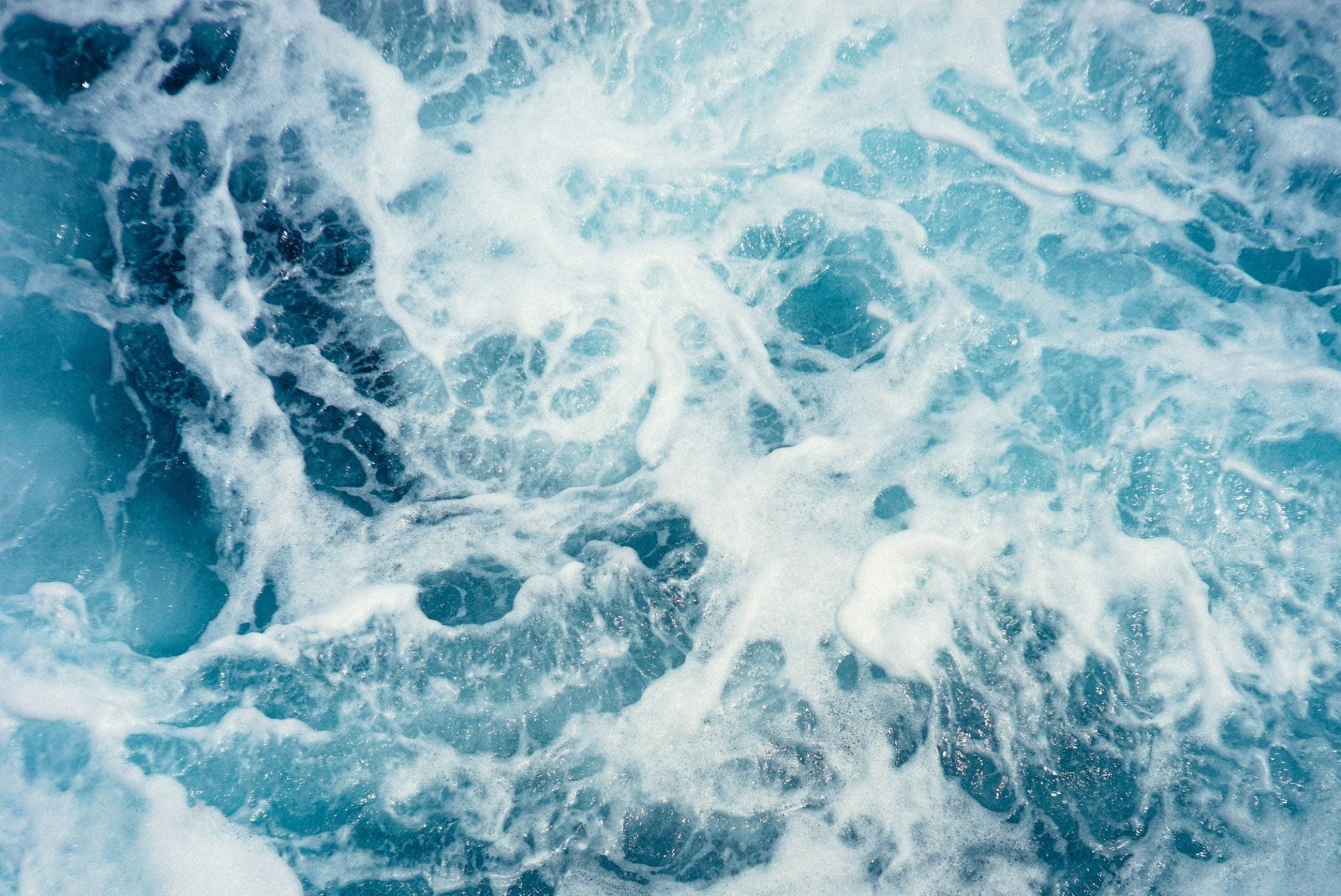 aerial shot of flowing ocean waves