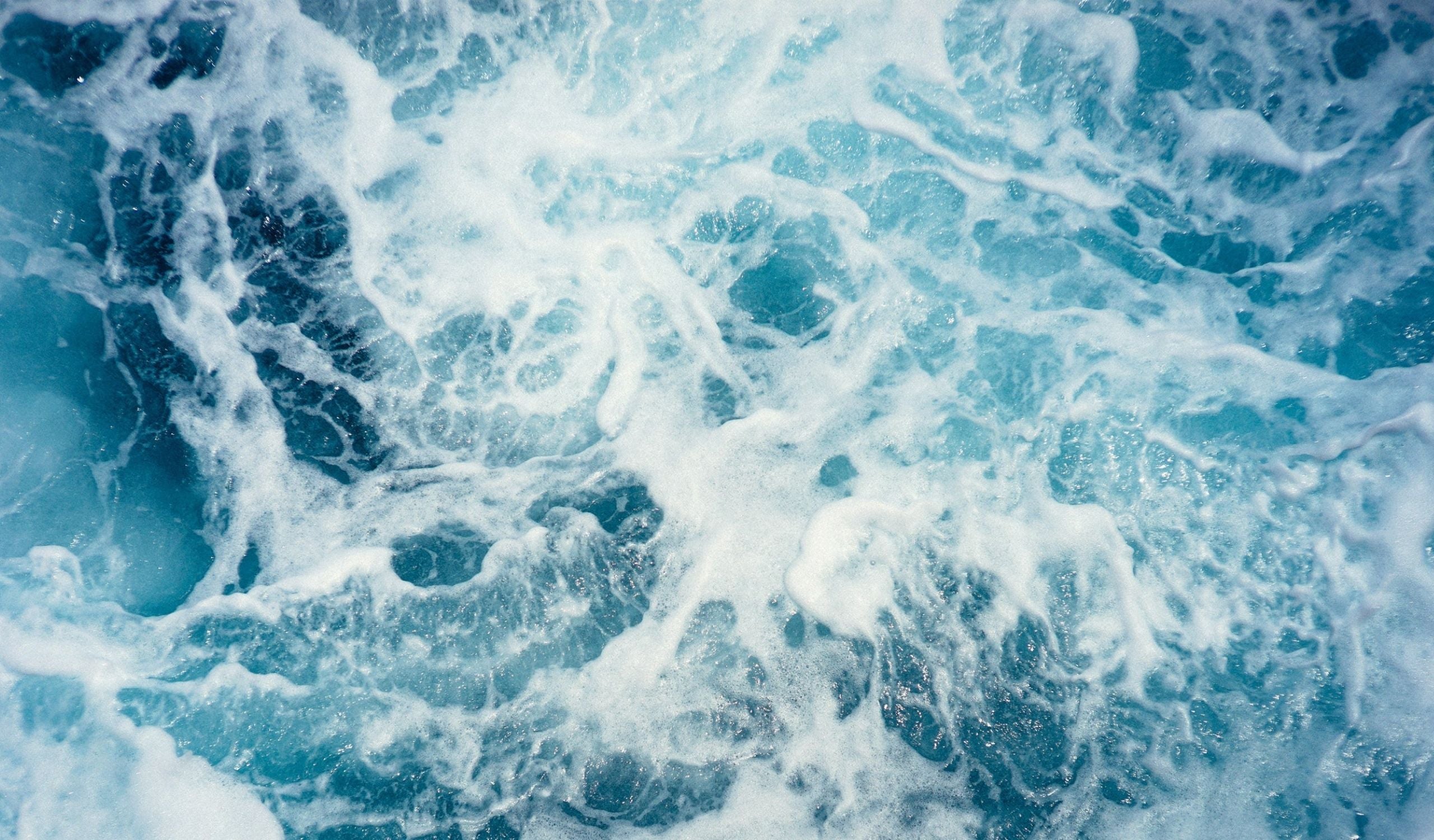 aerial shot of flowing ocean waves