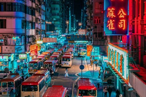 busy city street in Asia with lots of neon signs