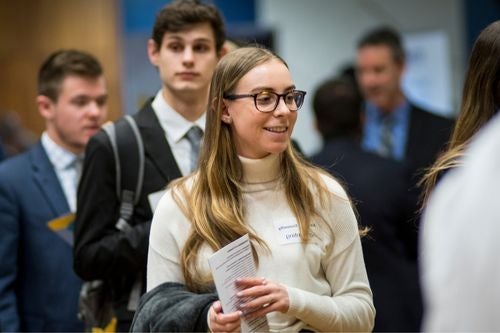a student wanders through a career fair