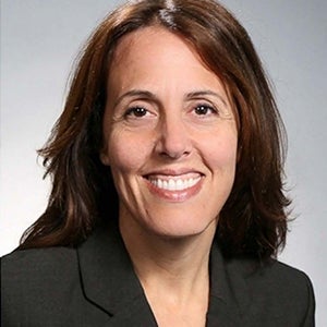 woman with dark hair smiling