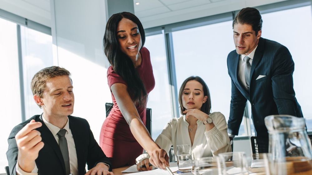 a group of business professionals around a table
