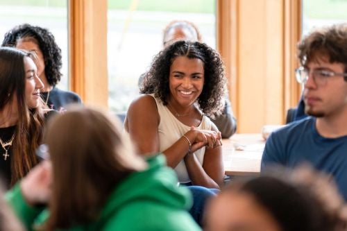 student smiles in class