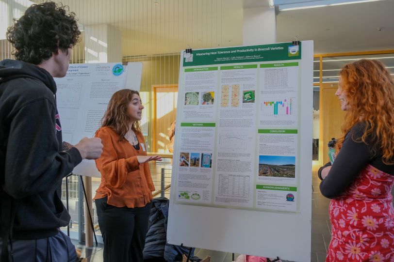 Student showing her poster
