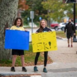 Students hold signs at this year’s Be 5K which raised over $3,300 for the Heather Fund
