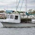 Image of a white fishing boat in the water