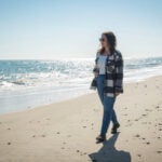 Erica Meier, a Rhode Island Sea Grant-University of Rhode Island Masters of Environmental Science and Management Communications fellow, walks South Kingstown Town Beach.