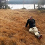 Author Graham Gardner relaxes in a meadow