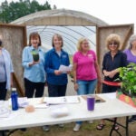 URI Master Gardeners gathered at East Farm at their annual seedling donation pickup in May