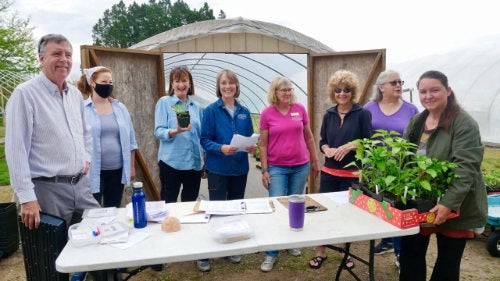 URI Master Gardeners gathered at East Farm at their annual seedling donation pickup in May