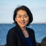 image of professor of Emi Uchida with the ocean in the background