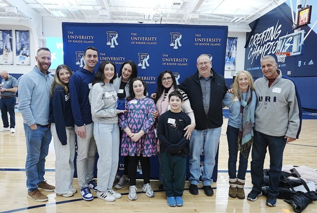 Many of Winnes’ family members who attended the awards ceremony also alumni of URI, including, from left, Dan Macera ’11, DPT’14; Lauren Macera ’12, DPT’14; Joshua Macera ’24; on the far right, John Macera ’87, P’11, P’24. Christopher Winnes, third from the right, is an assistant coach of the URI men’s club hockey team.