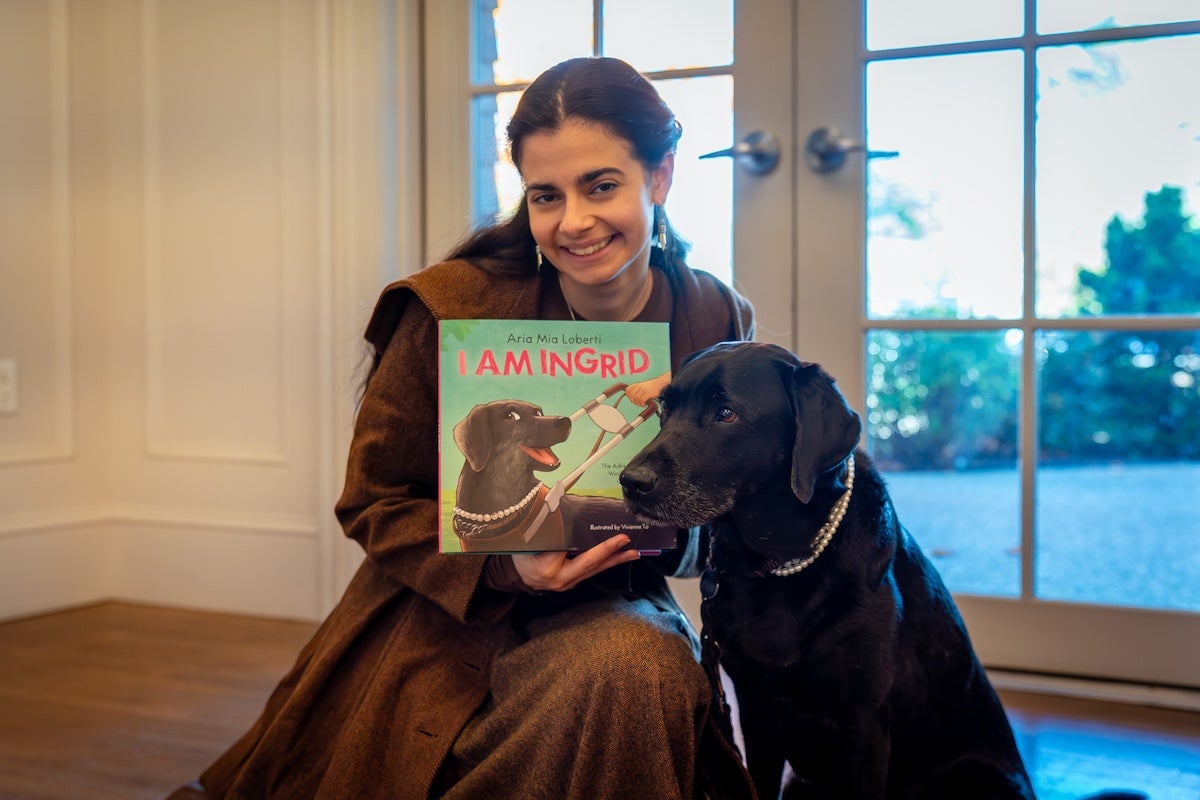 Actor, advocate and newly published author Aria Mia Loberti visited the URI Child Development Centers on Oct. 21 to teach preschoolers about a guide dog's impressive skills, and their special relationship with their human, the subject of her book, I Am Ingrid. Photos by Catherine Scott.