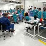 The research team at Kennedy Space Center confirming protocol and timing prior to receiving animals for post-flight sampling. The team included researchers, research assistants, and students from the United States and Japan.