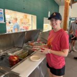 Olivia La Hue and Finnigan Schwoebel spent part of their internships preparing food at Camp Surefire, a camp in Rhode Island for children and teens with Type 1 diabetes.