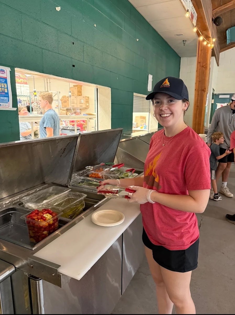 Olivia La Hue and Finnigan Schwoebel spent part of their internships preparing food at Camp Surefire, a camp in Rhode Island for children and teens with Type 1 diabetes.