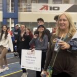 Attendees are seen walking around Mackal Gymnasium, wearing pins and beads of support. (Courtesy of Kerrie Constant)