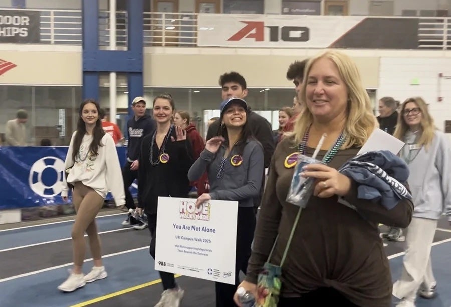 Attendees are seen walking around Mackal Gymnasium, wearing pins and beads of support. (Courtesy of Kerrie Constant)