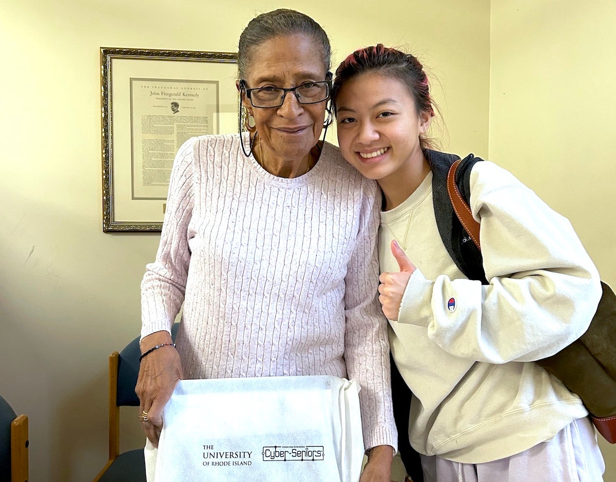 A URI student meets with her partner in the Cyber-Seniors program.