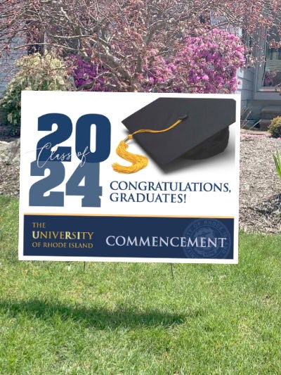 Lawn sign congratulating graduates of the URI Class of 2024