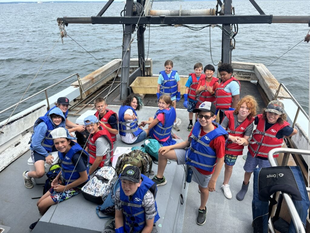 youth program participants on boat