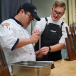 Chef teaching knive skills