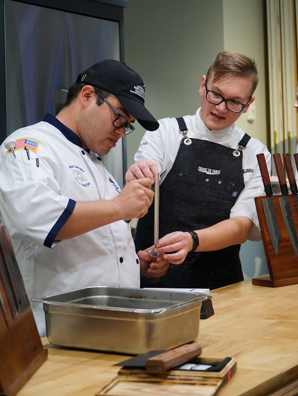 Chef teaching knive skills