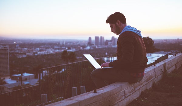 A student working on the computer while studying abroad