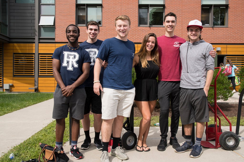 6 students smiling in front of Hillside Hall.