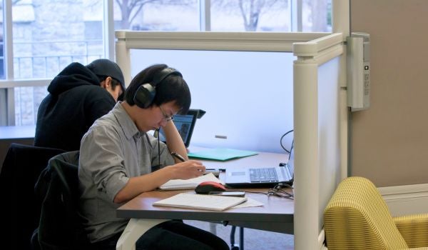 a student studying with headphones on