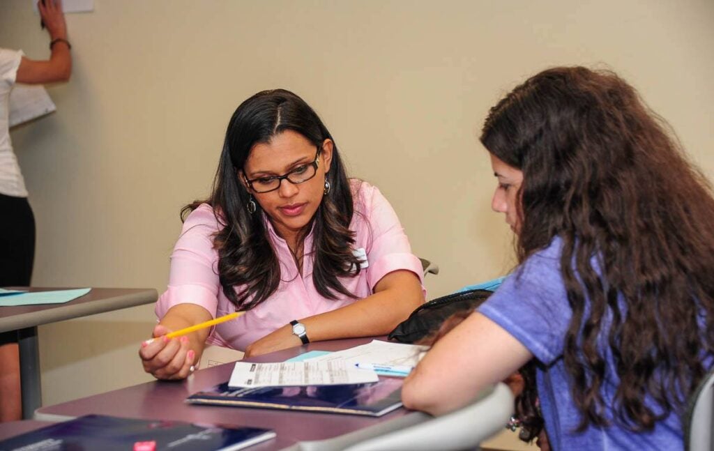 A student working closely with a faculty member