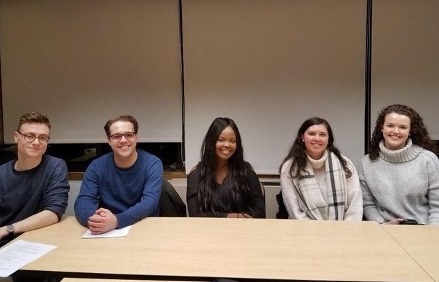 a group of economics students sitting together