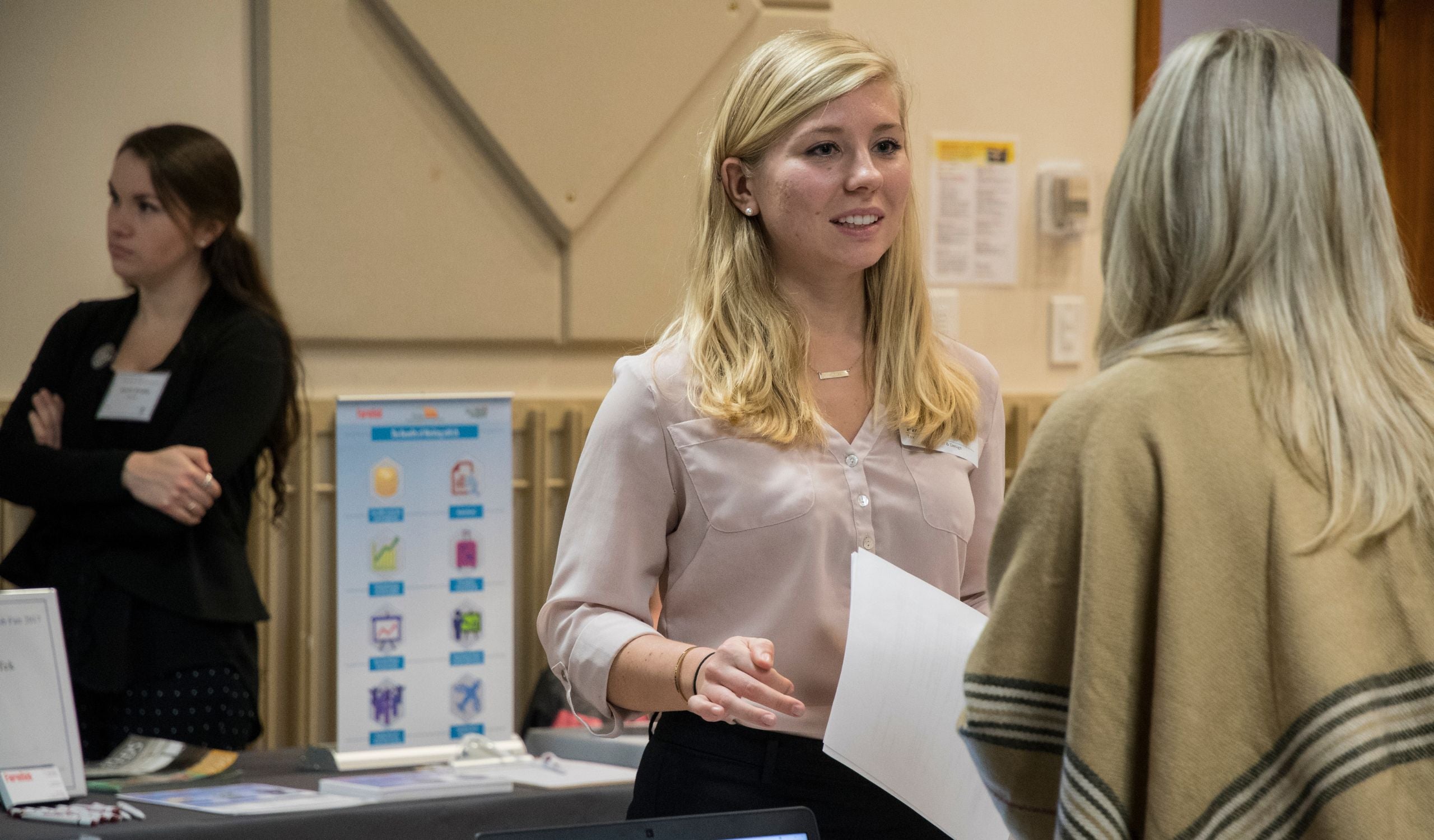 a student dressed professionally at a career fair