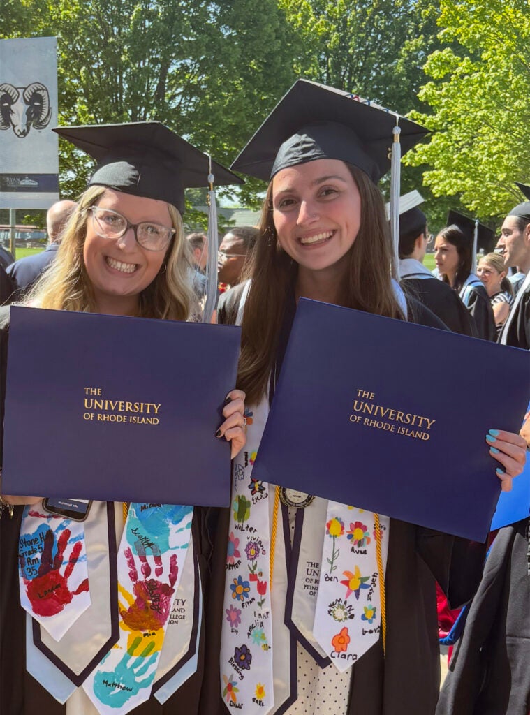 Corcoran and Flynn celebrate their URI graduation together in May 2025.