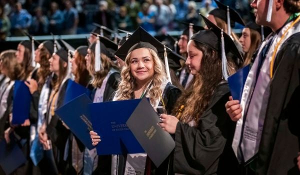 college students at graduation