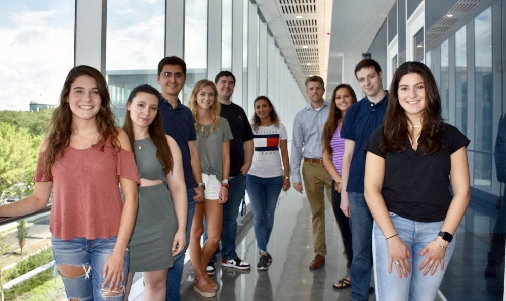 A group shot of students working in the NanoBio Engineering Laboratory