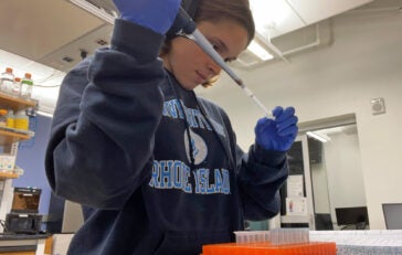 Lauren Hubert using pipette to extract plasmid DNA