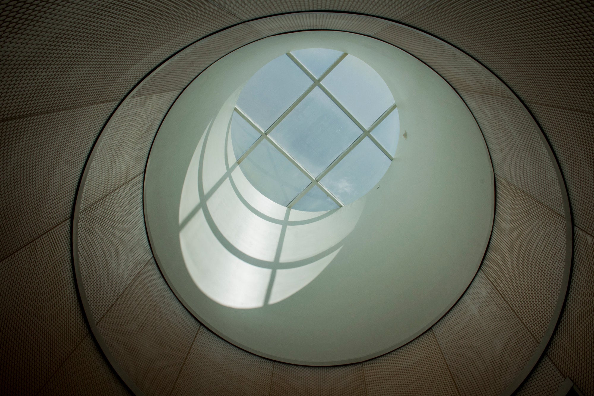A distinctive oculus adds natural light to enter the building.