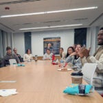 Students discuss in a large group how skills learned abroad can help them in their careers