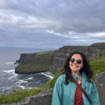 Emily Principe at a dramatic coastline in Europe