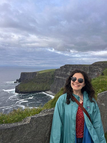 Emily Principe at a dramatic coastline in Europe